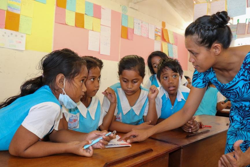 Instructors leading a workshop on crafting compelling scholarship essays and application strategies,
A bustling fair with booths from various community colleges,
providing information on available scholarships,
A success story featuring a scholarship alumnus who has achieved notable accomplishments in their field,
A plaque displayed in honor of scholarship contributors,Kiribati Students