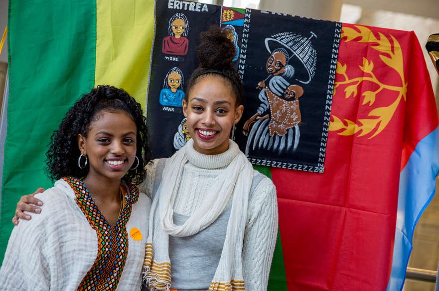 Graduation caps adorned with symbols representing various academic achievements,
worn by scholarship recipients,
A colorful flyer promoting a scholarship outreach event,
featuring images and key information for potential applicants,
A luncheon event where scholarship recipients express gratitude to donors and share their academic journeys,Eritrea Students