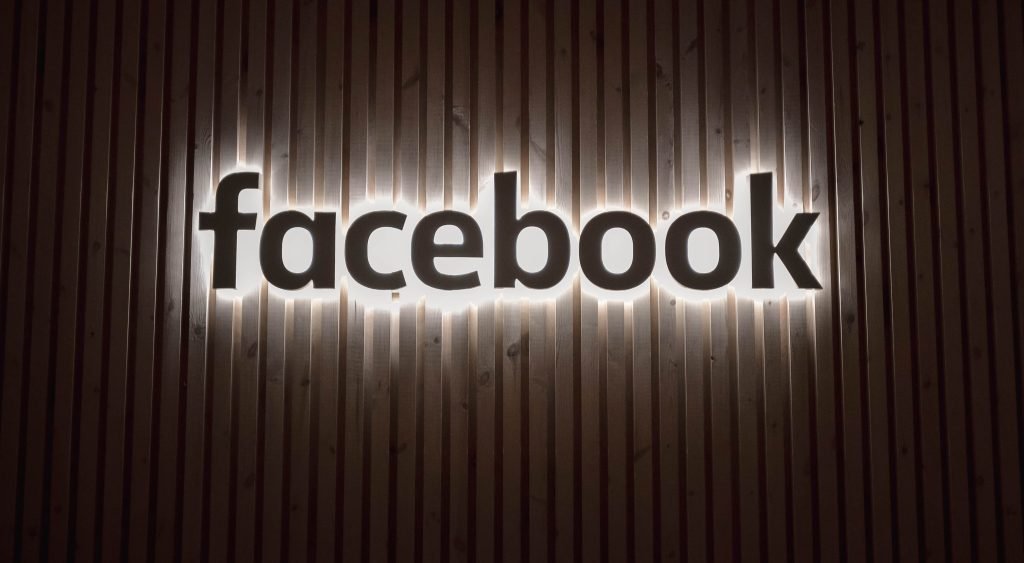 A composite image showing a Facebook logo combined with a financial graph, representing the transformation of socializing into financial success on the platform,A person pondering while looking at a computer screen, representing the curiosity of turning Facebook time into income.
