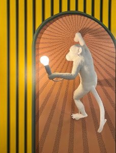 A person sitting in thoughtful reflection, representing the culmination of the positivity journey and planning for the future,An uplifting image of a person embracing life with open arms, signifying the transformative power of positivity.